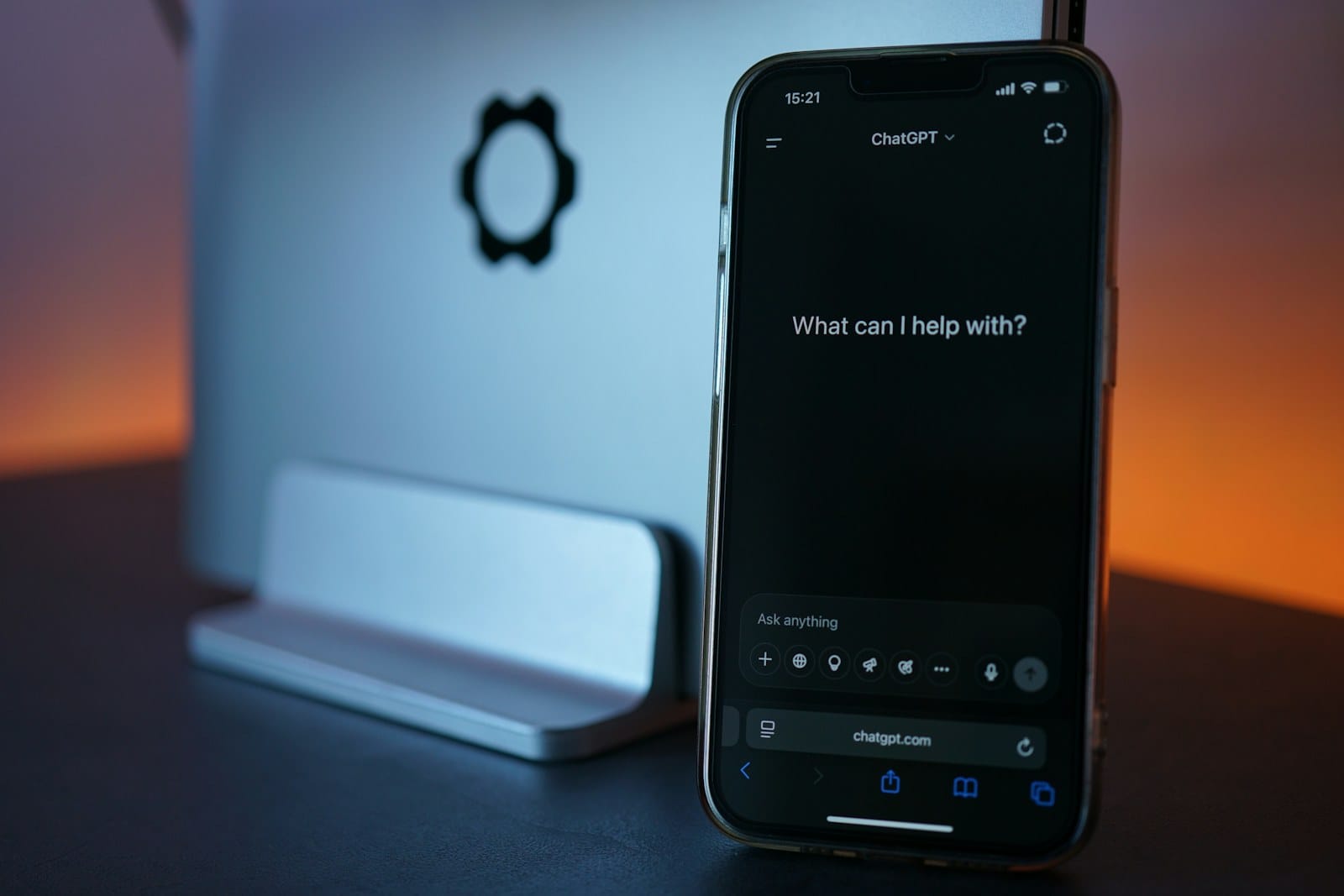 The ChatGPT app open on a phone over a keyboard.