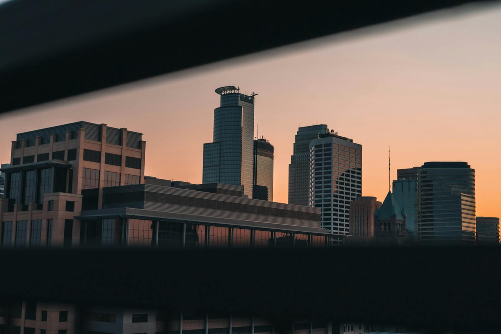 A calm city skyline at first light, representing recovery after a digital crisis
